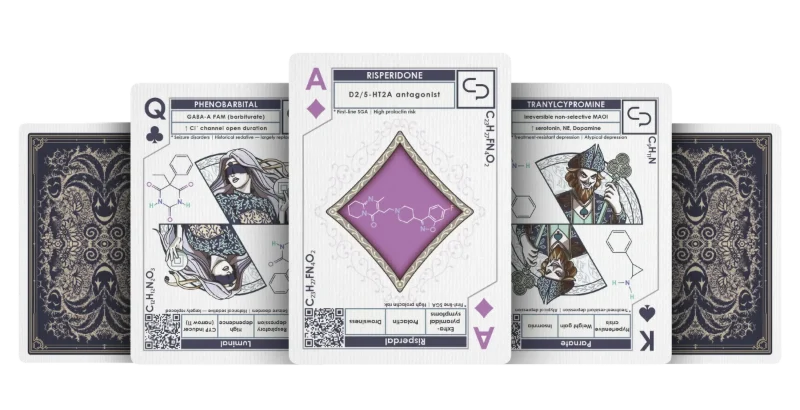 Psychiatry deck cards fanned out: the Queen (Phenobarbital), Ace (Risperidone) and King (Tranylcypromine) between two card backs.